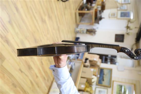 A mid 19th century German violin, bears Nicolas label, cased with a silver mounted bow, back 36cm